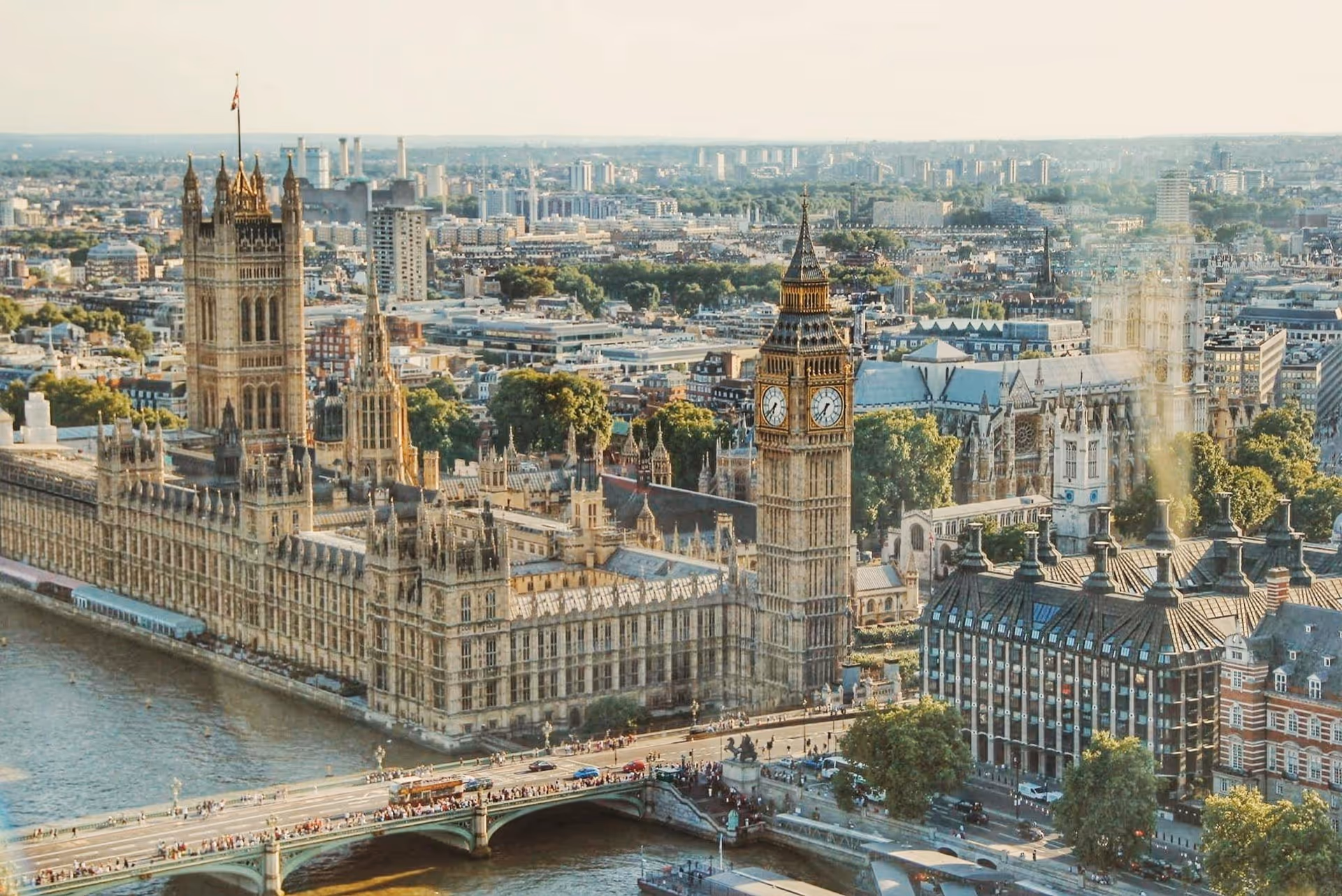Aerial view of the Palace of Westminster with Big Ben clock tower and Westminster Bridge over the River Thames in London.